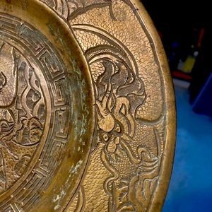 antique brass plate with dragon theme throughout